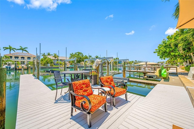 903 Pinellas Bayway S Unit 103, Tierra Verde, FL 33715 - dock with boat lift and a water view