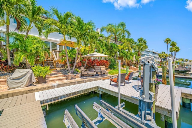 903 Pinellas Bayway S Unit 103, Tierra Verde, FL 33715 - dock area with boat lift and stairway