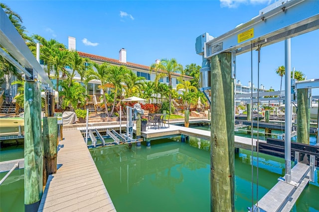 903 Pinellas Bayway S Unit 103, Tierra Verde, FL 33715 - dock with boat lift and a water view