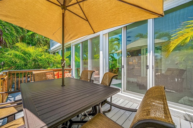 903 Pinellas Bayway S Unit 103, Tierra Verde, FL 33715 - wooden deck featuring outdoor dining area