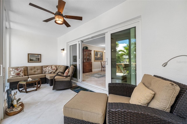 903 Pinellas Bayway S Unit 103, Tierra Verde, FL 33715 - living area featuring a ceiling fan and light tile patterned flooring