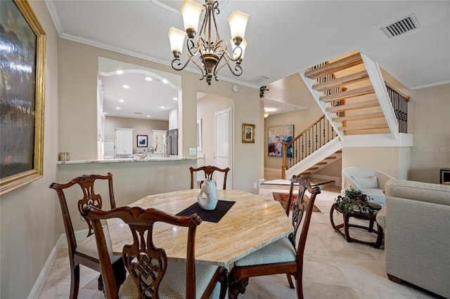 903 Pinellas Bayway S Unit 103, Tierra Verde, FL 33715 - dining area with a chandelier, stairway, ornamental molding, baseboards, and recessed lighting