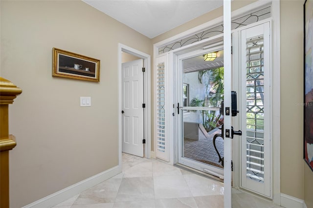 903 Pinellas Bayway S Unit 103, Tierra Verde, FL 33715 - entryway featuring baseboards