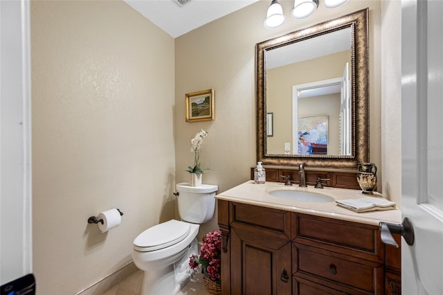 903 Pinellas Bayway S Unit 103, Tierra Verde, FL 33715 - half bath featuring toilet, vanity, and baseboards