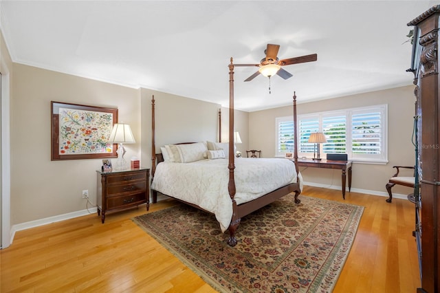 903 Pinellas Bayway S Unit 103, Tierra Verde, FL 33715 - bedroom featuring baseboards, light wood finished floors, and ceiling fan