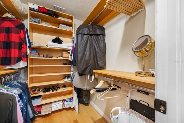 903 Pinellas Bayway S Unit 103, Tierra Verde, FL 33715 - spacious closet featuring wood finished floors