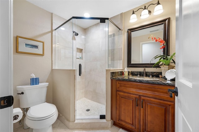 903 Pinellas Bayway S Unit 103, Tierra Verde, FL 33715 - full bathroom featuring toilet, vanity, a stall shower, and tile patterned floors