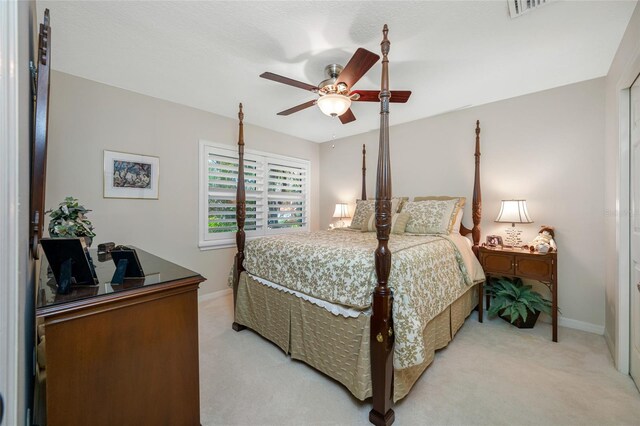 903 Pinellas Bayway S Unit 103, Tierra Verde, FL 33715 - bedroom featuring light carpet, baseboards, ceiling fan, and an office area