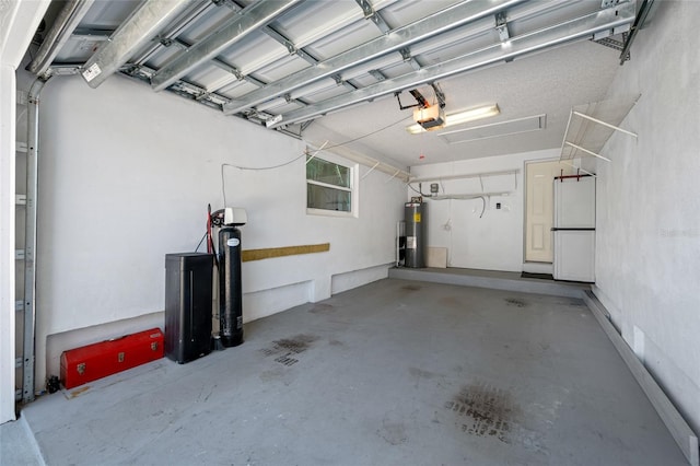 903 Pinellas Bayway S Unit 103, Tierra Verde, FL 33715 - garage featuring a garage door opener and water heater