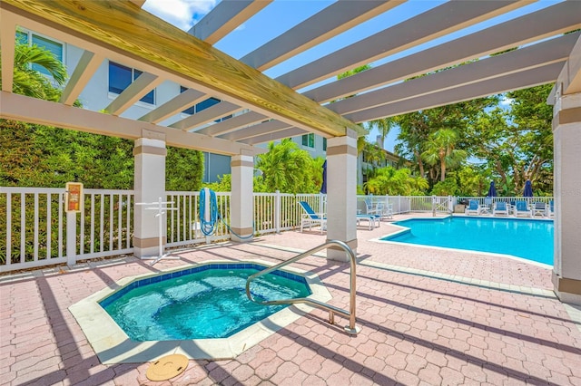 903 Pinellas Bayway S Unit 103, Tierra Verde, FL 33715 - community pool with a community hot tub, a pergola, and a patio