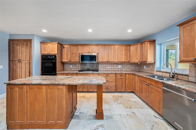 2309 Cypress Walk Way, Ruskin, FL 33570 - kitchen featuring stainless steel appliances, a sink, stone tile floors, tasteful backsplash, and recessed lighting