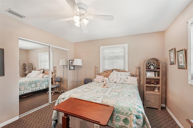 708 Rutgers Pl, Sun City Center, FL 33573 - carpeted bedroom with a closet, a ceiling fan, and baseboards