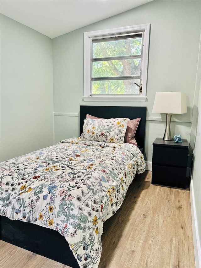 5654 12th St, Zephyrhills, FL 33542 - bedroom featuring wood finished floors and baseboards