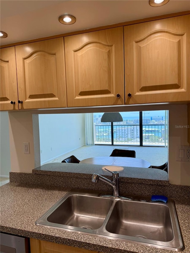 400 Island Way Unit 1402, Clearwater Beach, FL 33767 - kitchen view of a sink, light brown cabinetry, dark countertops, and recessed lighting