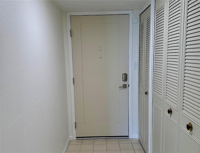 400 Island Way Unit 1402, Clearwater Beach, FL 33767 - doorway featuring light tile patterned floors and baseboards