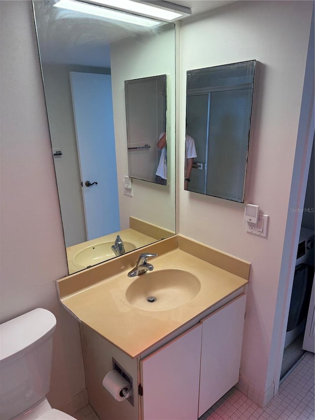 400 Island Way Unit 1402, Clearwater Beach, FL 33767 - bathroom featuring vanity, toilet, and tile patterned flooring