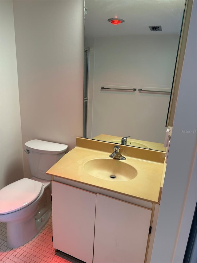 400 Island Way Unit 1402, Clearwater Beach, FL 33767 - bathroom with vanity, toilet, and tile patterned floors