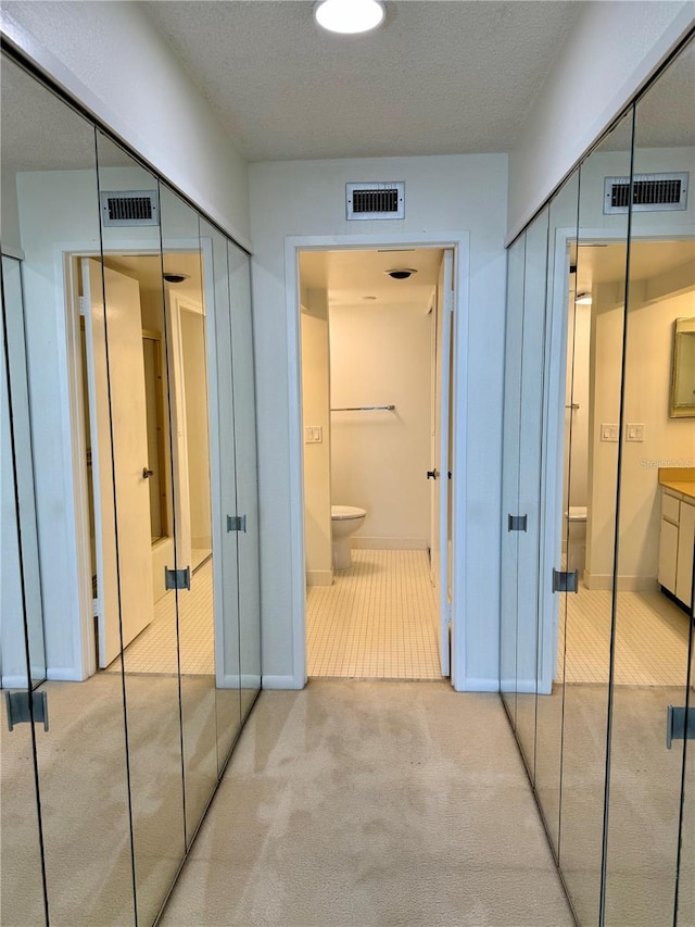 400 Island Way Unit 1402, Clearwater Beach, FL 33767 - hallway with carpet floors and baseboards