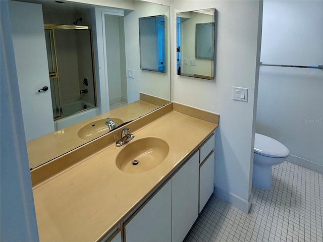 400 Island Way Unit 1402, Clearwater Beach, FL 33767 - bathroom with baseboards, tile patterned floors, toilet, and vanity
