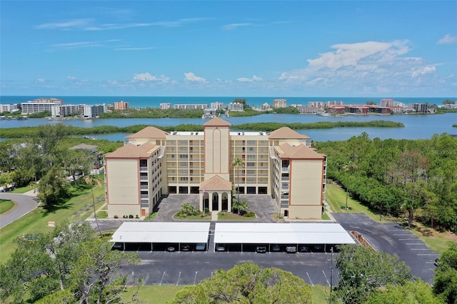 9000 Commodore Dr Unit 606, Seminole, FL 33776 - drone / aerial view of apartment complex and a large body of water