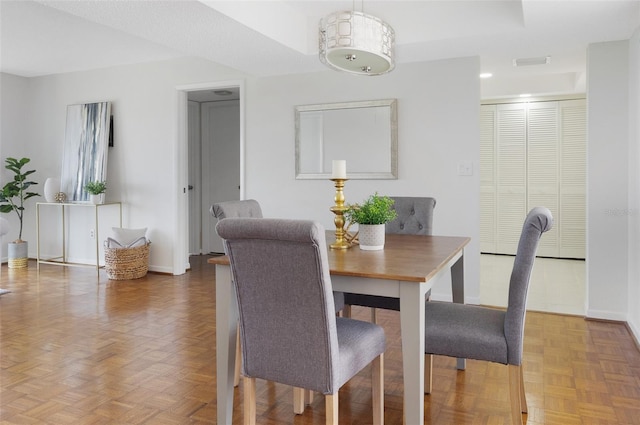 9000 Commodore Dr Unit 606, Seminole, FL 33776 - dining room featuring baseboards