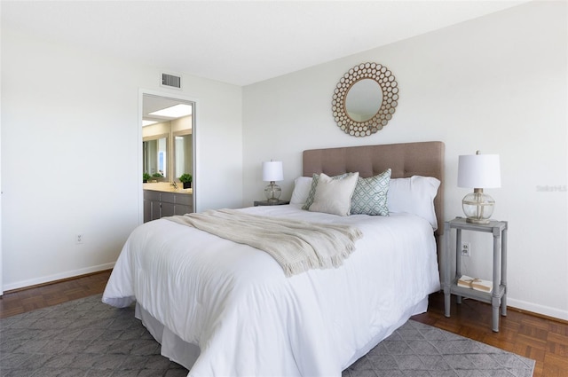 9000 Commodore Dr Unit 606, Seminole, FL 33776 - bedroom with baseboards and ensuite bathroom