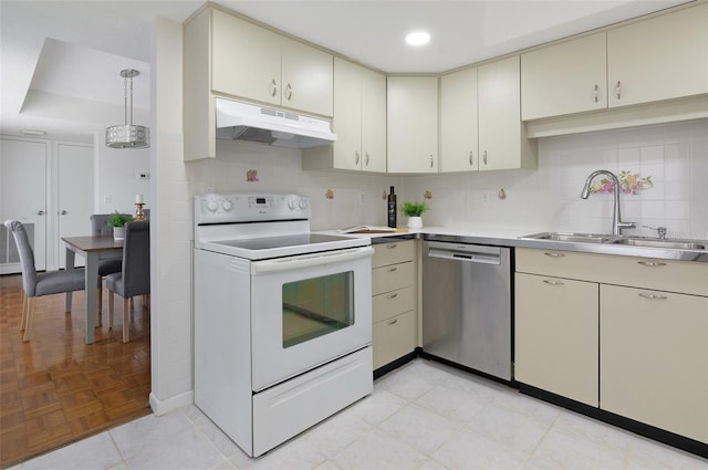 9000 Commodore Dr Unit 606, Seminole, FL 33776 - kitchen with dishwasher, white range with electric cooktop, under cabinet range hood, cream cabinets, and recessed lighting