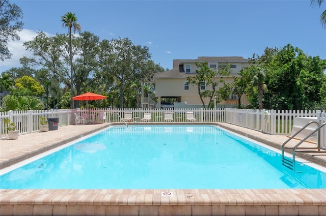 9000 Commodore Dr Unit 606, Seminole, FL 33776 - community pool featuring a patio area