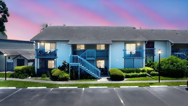 11201 122nd Ave Unit 167, Largo, FL 33778 - view of building exterior with uncovered parking and stairs