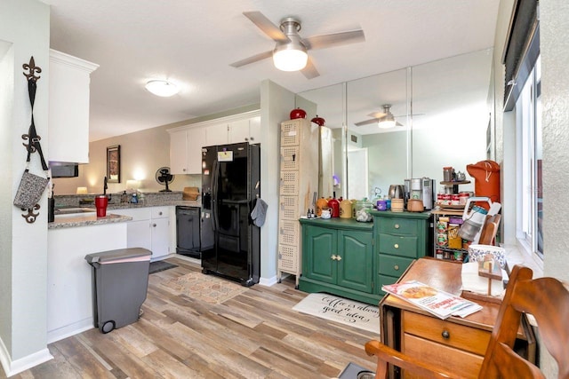 11201 122nd Ave Unit 167, Largo, FL 33778 - kitchen featuring black appliances, ceiling fan, light wood finished floors, and white cabinets