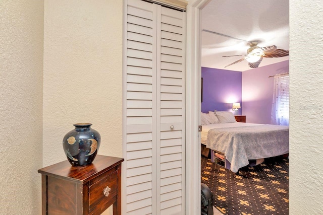 11201 122nd Ave Unit 167, Largo, FL 33778 - bedroom featuring a textured wall and ceiling fan