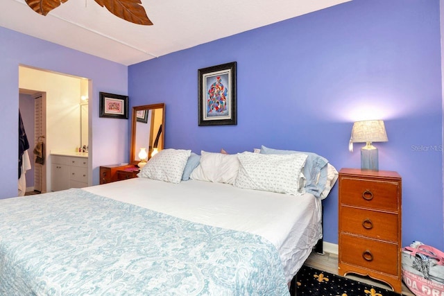 11201 122nd Ave Unit 167, Largo, FL 33778 - bedroom featuring ensuite bathroom and ceiling fan