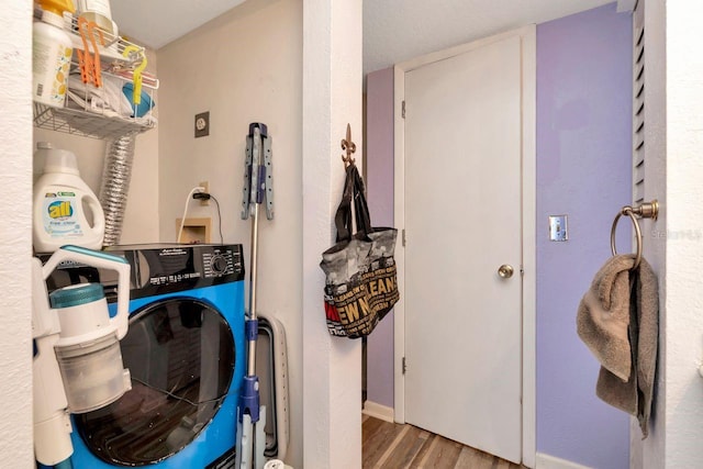 11201 122nd Ave Unit 167, Largo, FL 33778 - laundry room featuring wood finished floors and washer / dryer