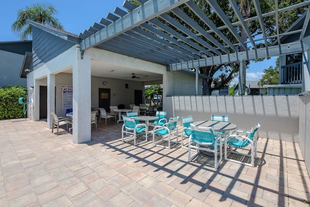 11201 122nd Ave Unit 167, Largo, FL 33778 - view of patio featuring outdoor dining space, a pergola, and a ceiling fan
