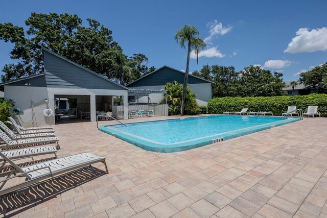 11201 122nd Ave Unit 167, Largo, FL 33778 - community pool with a patio area