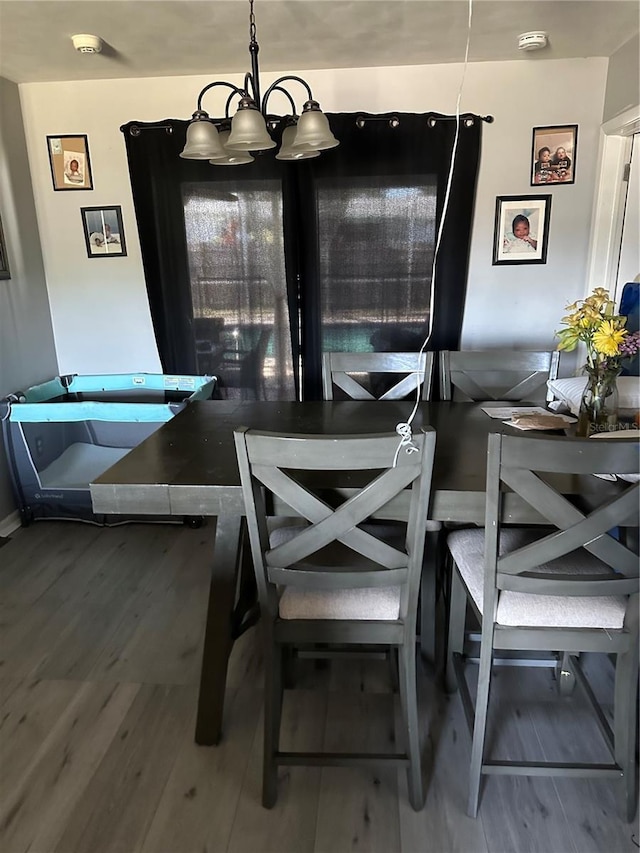 2198 Academy Dr, Clearwater, FL 33764 - dining space featuring a chandelier and wood finished floors