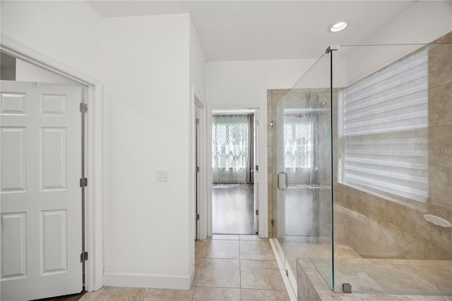 17668 Bright Wheat Dr, Lithia, FL 33547 - full bath featuring a shower stall, tile patterned flooring, and baseboards