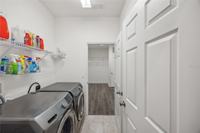 17668 Bright Wheat Dr, Lithia, FL 33547 - laundry area featuring washing machine and dryer and light tile patterned flooring