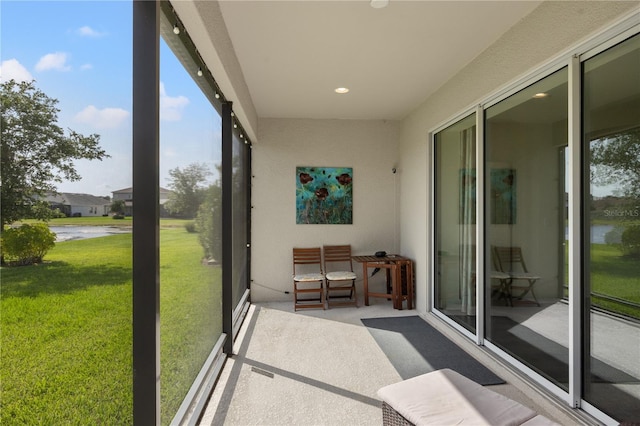 17668 Bright Wheat Dr, Lithia, FL 33547 - sunroom / solarium with healthy amount of natural light and a water view