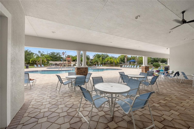 17668 Bright Wheat Dr, Lithia, FL 33547 - view of patio / terrace with a community pool and ceiling fan