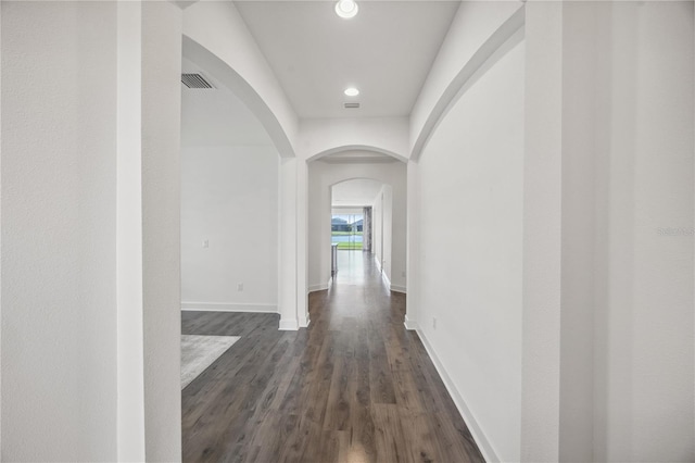 17668 Bright Wheat Dr, Lithia, FL 33547 - hall with arched walkways, dark wood-style flooring, baseboards, and recessed lighting