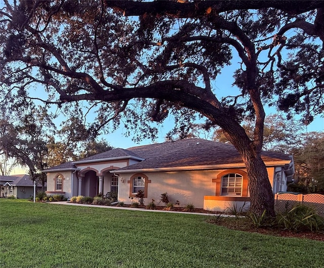 13133 Roseanna Dr, Spring Hill, FL 34609 - single story home featuring stucco siding and a front lawn