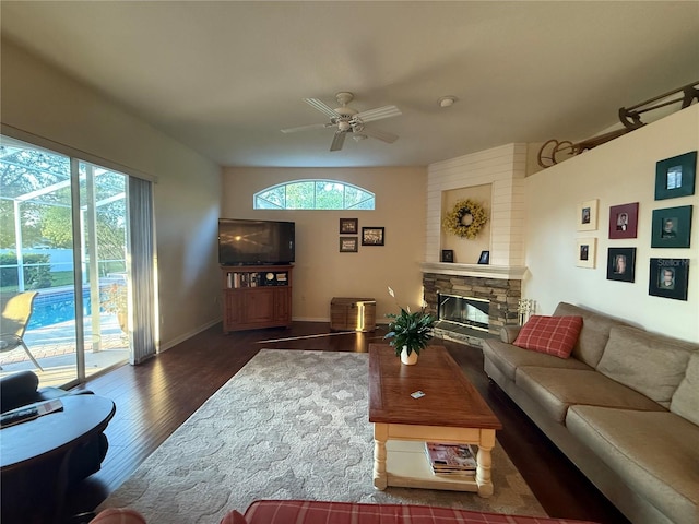 13133 Roseanna Dr, Spring Hill, FL 34609 - living area featuring wood finished floors, a fireplace, a ceiling fan, and baseboards