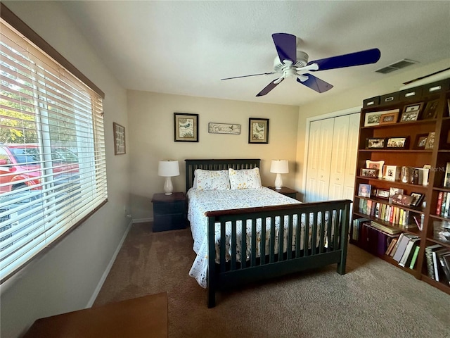 13133 Roseanna Dr, Spring Hill, FL 34609 - bedroom featuring carpet, a closet, baseboards, and a ceiling fan