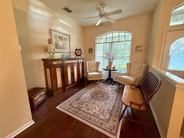 13133 Roseanna Dr, Spring Hill, FL 34609 - sitting room with plenty of natural light, dark wood-style floors, and ceiling fan