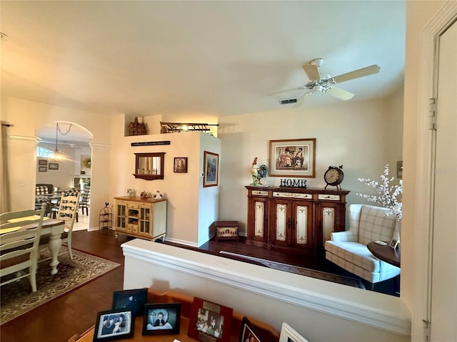 13133 Roseanna Dr, Spring Hill, FL 34609 - living room featuring ceiling fan and arched walkways