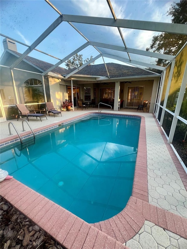 13133 Roseanna Dr, Spring Hill, FL 34609 - swimming pool featuring a patio and glass enclosure
