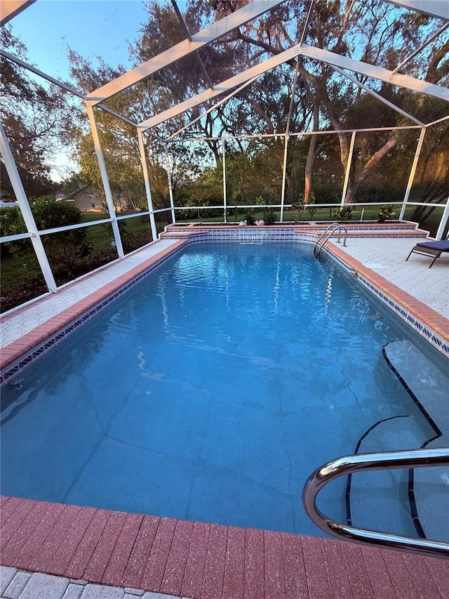 13133 Roseanna Dr, Spring Hill, FL 34609 - swimming pool featuring glass enclosure and a patio