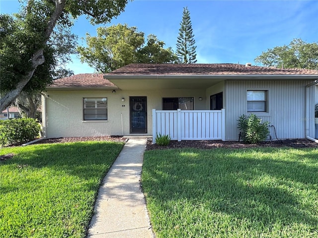 30 Tads Trl, Oldsmar, FL 34677 - view of front of property with a front yard and stucco siding