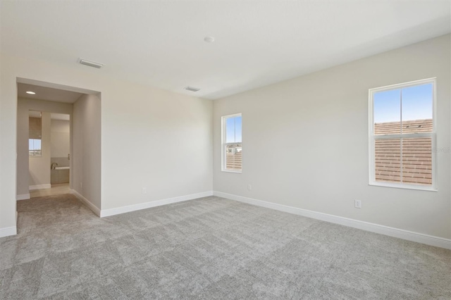 10320 Longmeadow Ave, Parrish, FL 34219 - spare room with carpet floors and baseboards